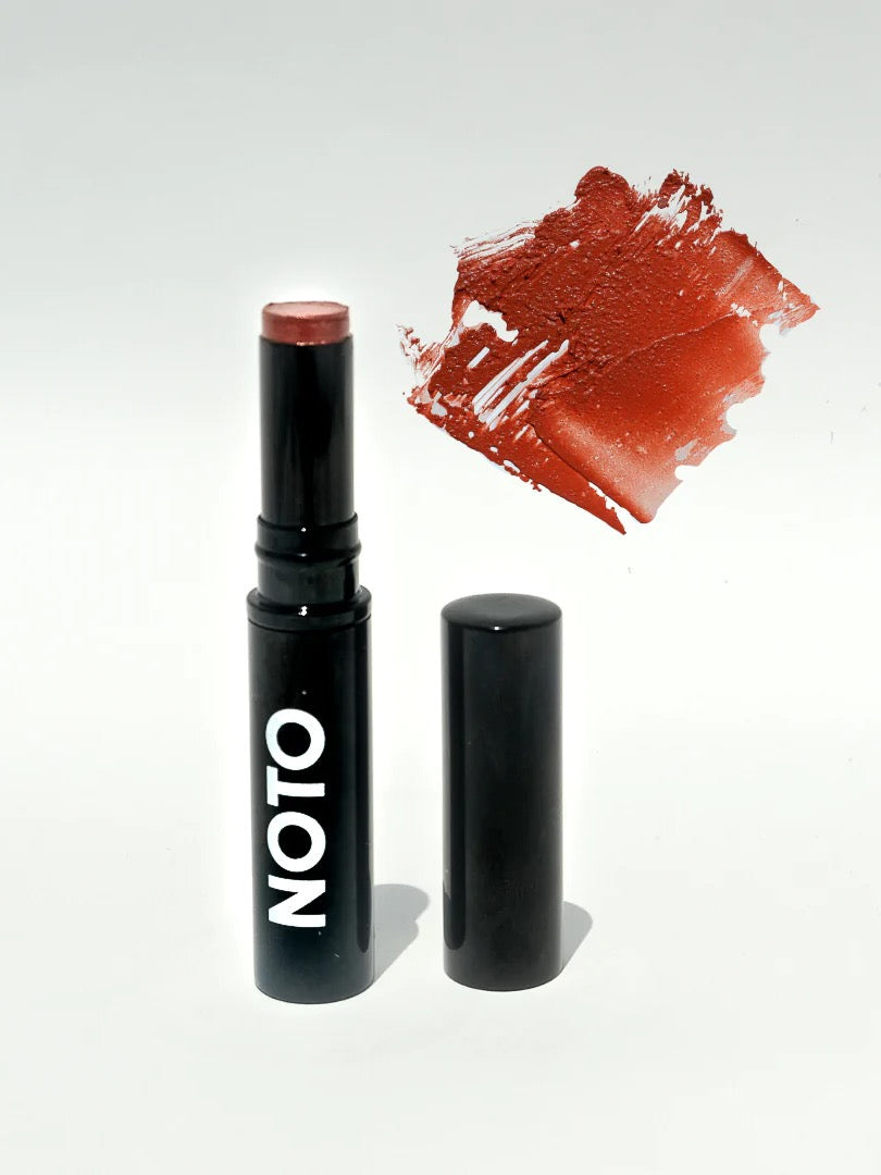 A NOTO Ono Ono – Multi-Bene Stain Stick // Lips + Cheeks with a red color next to it.