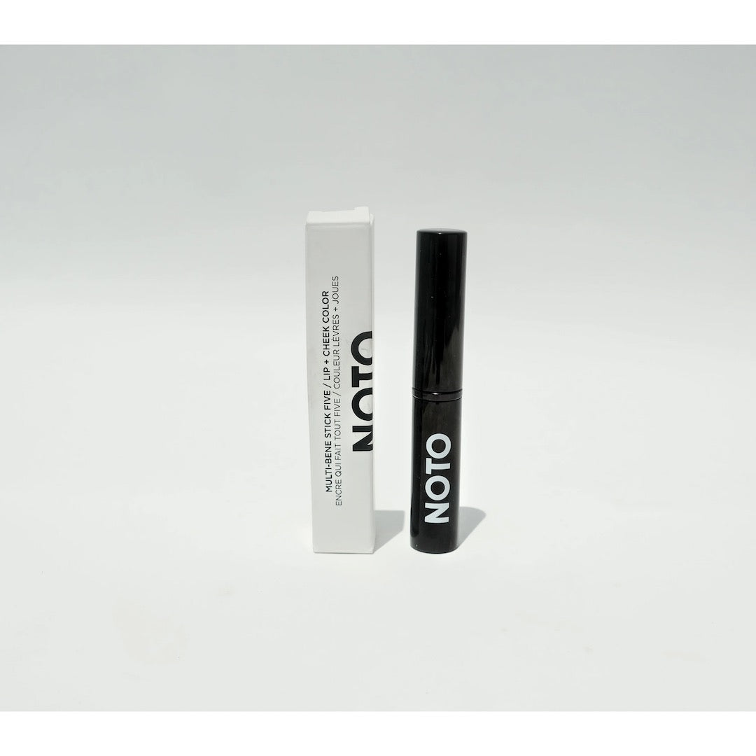 A black tube of NOTO&#39;s Five – Multi-Bene Stain Stick // Lips + Cheeks on a white background.