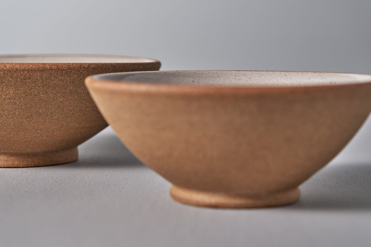 Two Nicola Shuttleworth Condiment Bowls - Small on a grey surface.
