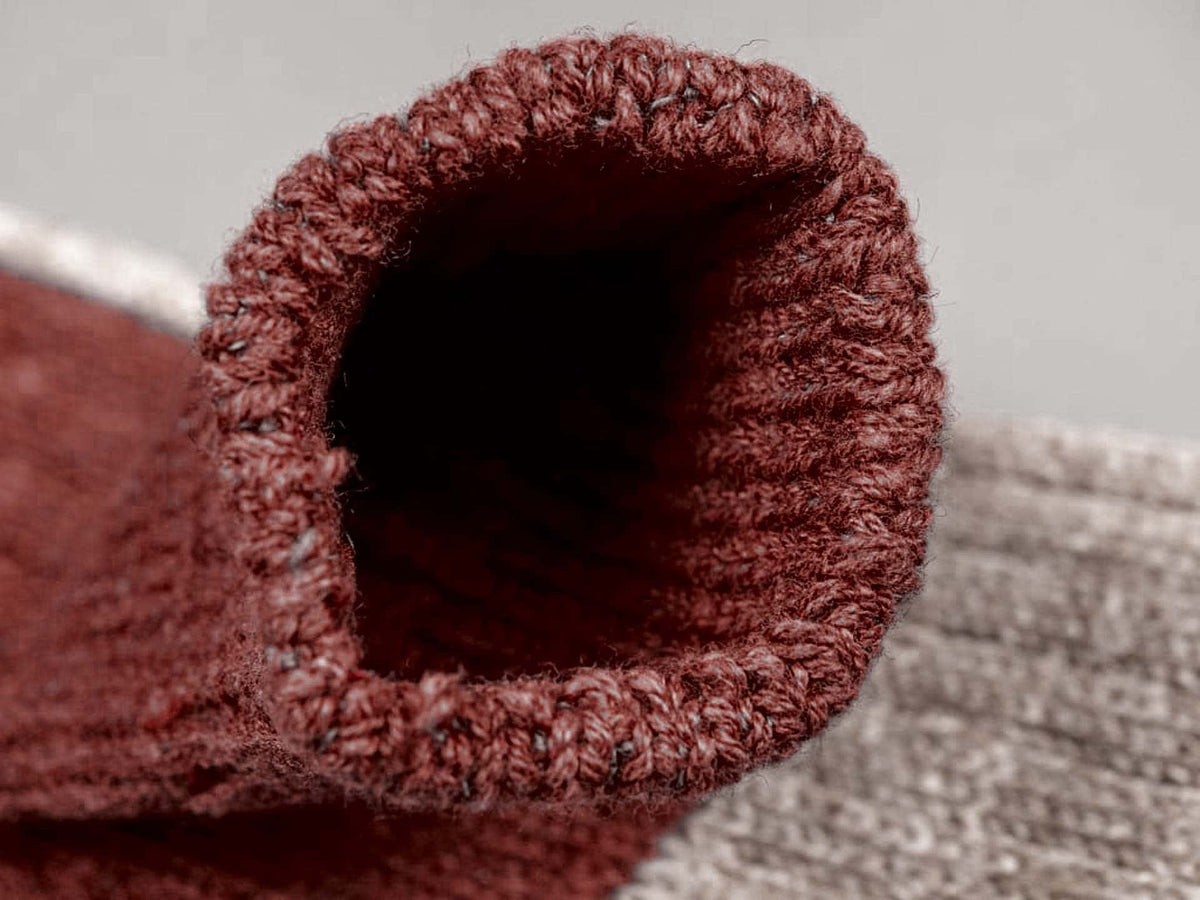 A close up of a Boston Slab Socks – Red Brick by Nishiguchi Kutsushita.