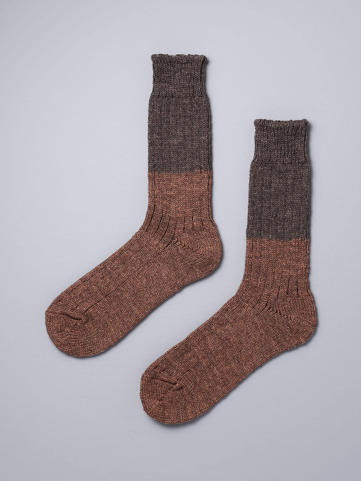 A pair of Boston Slab Socks – Brown Fawn by Nishiguchi Kutsushita on a white background.
