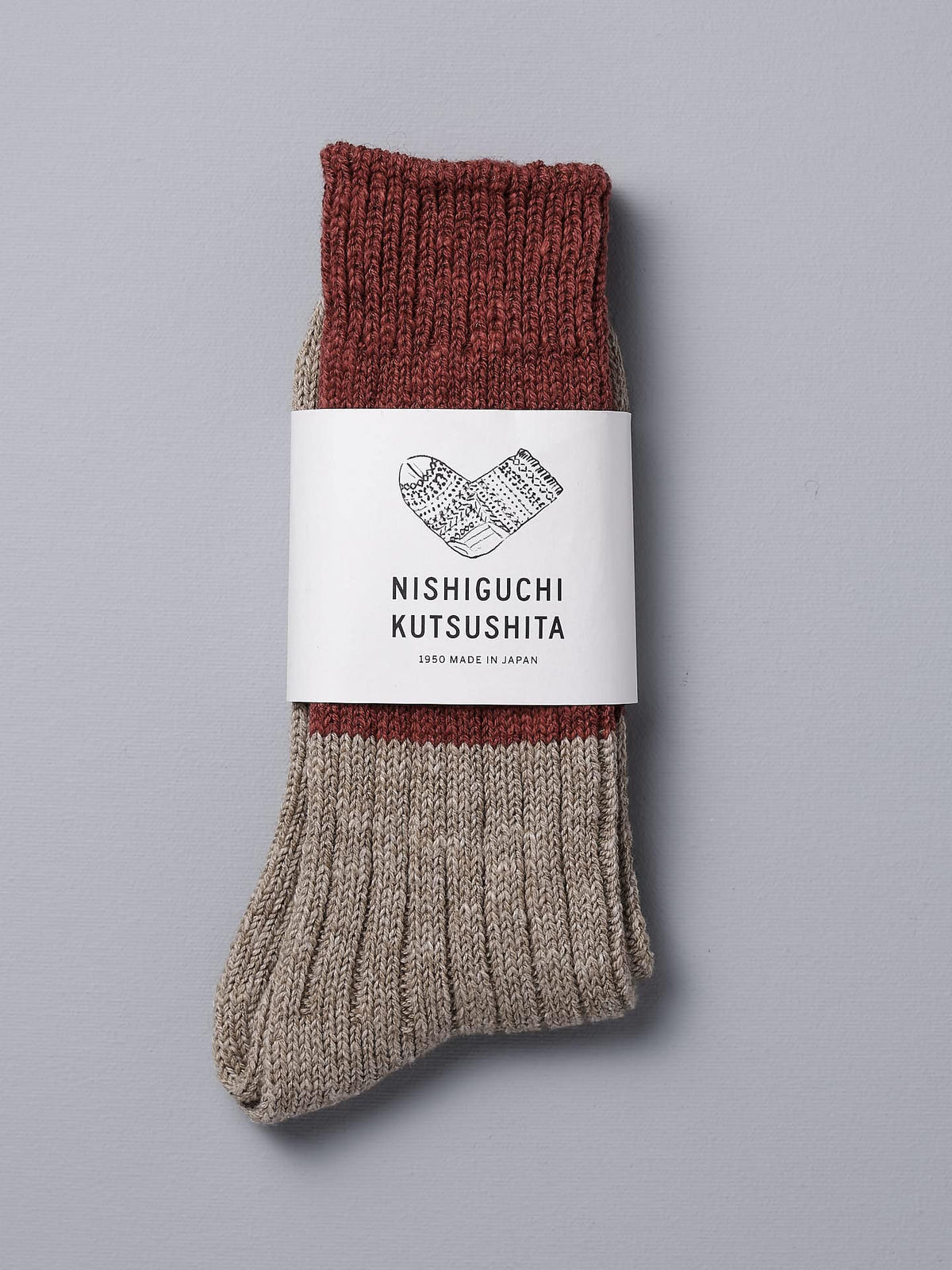 A pair of Boston Slab Socks – Red Brick with a Nishiguchi Kutsushita label.