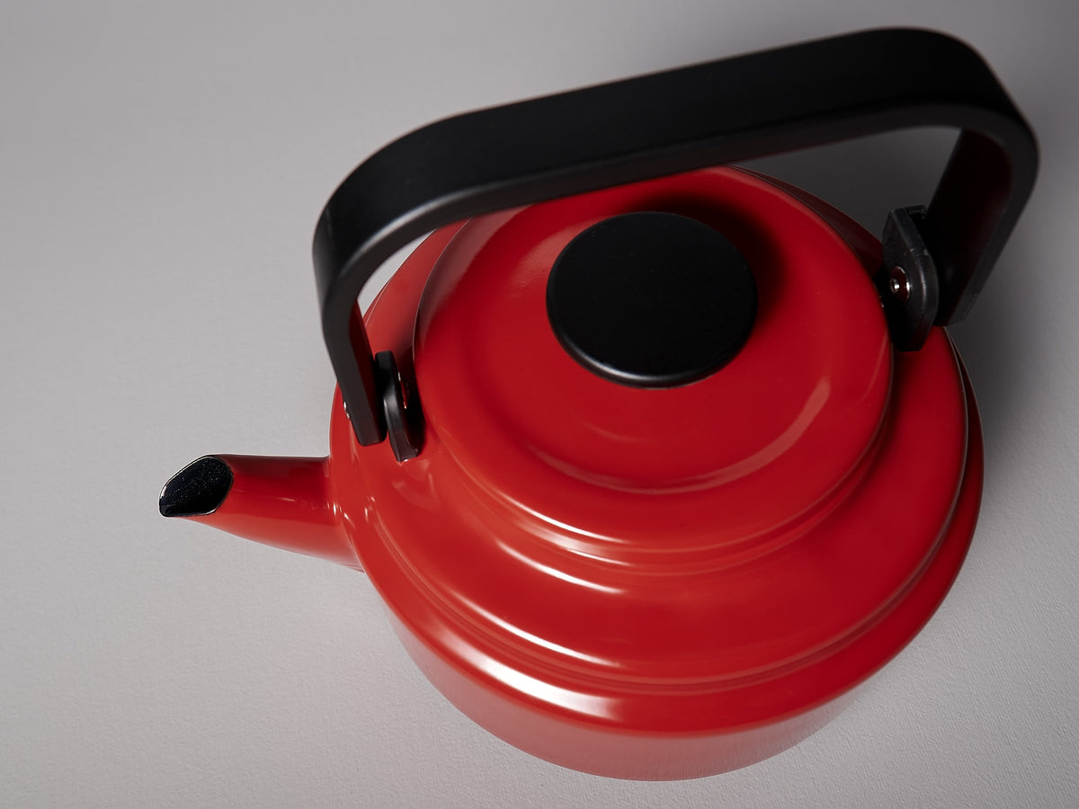 An Amu Stove-top Kettle - Red by Noda Horo on a white background.