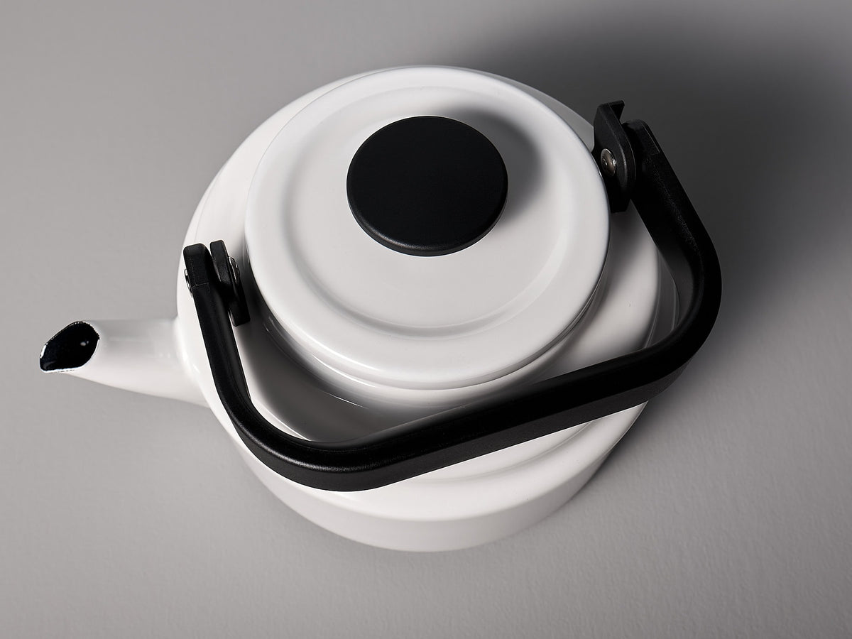 An Amu Stove-top Kettle - White by Noda Horo on a gray background.