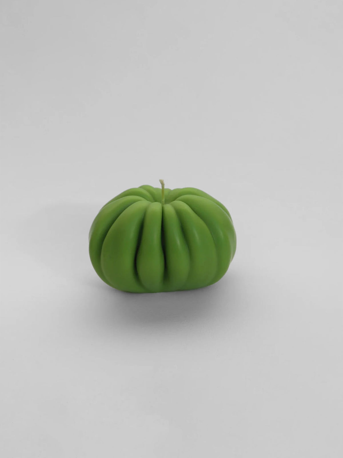 A Green Heirloom Tomato Candle – Medium by Nonna&#39;s Grocer on a white background.