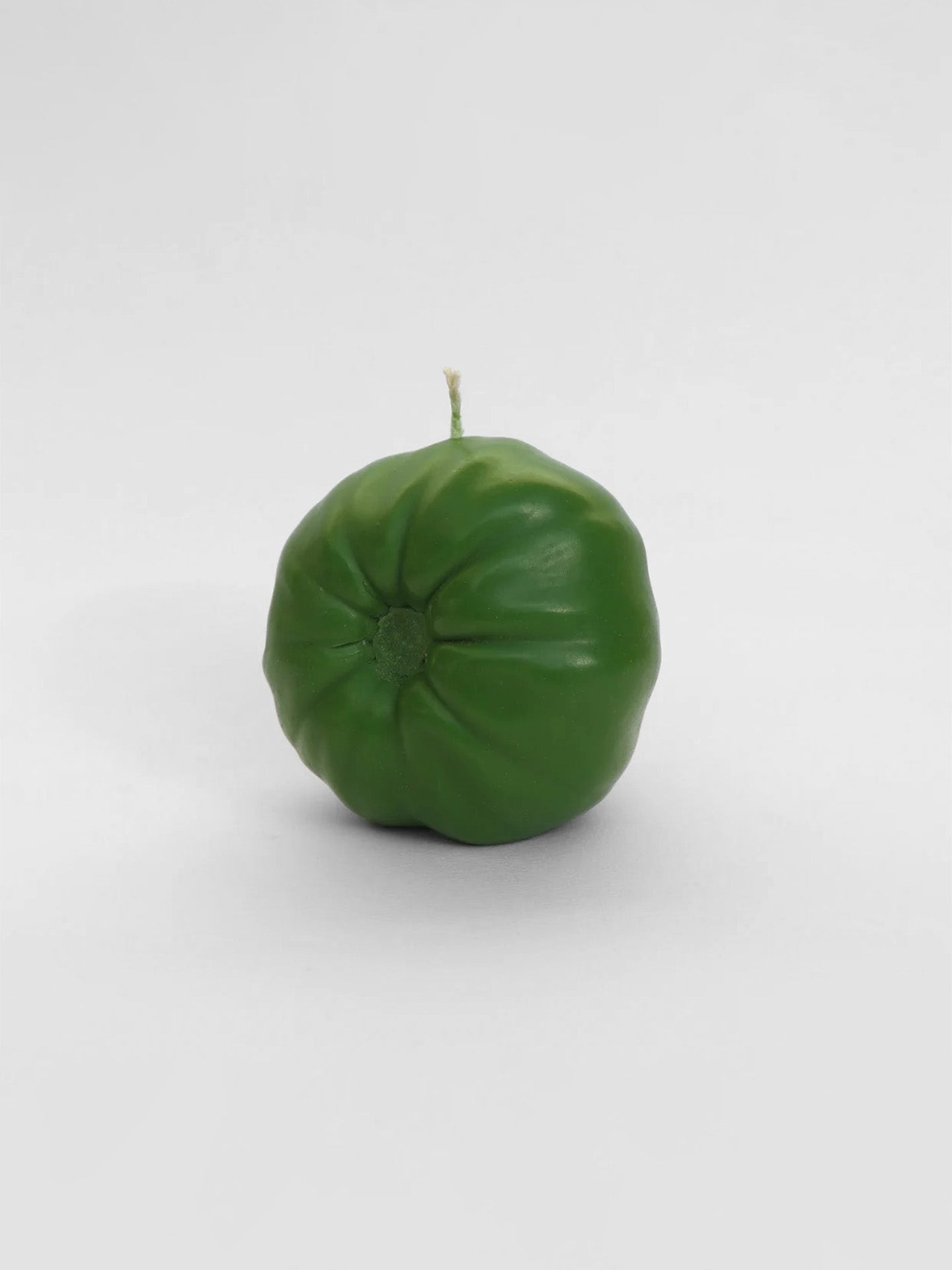 A Green Heirloom Tomato Candle - Large on a white background.