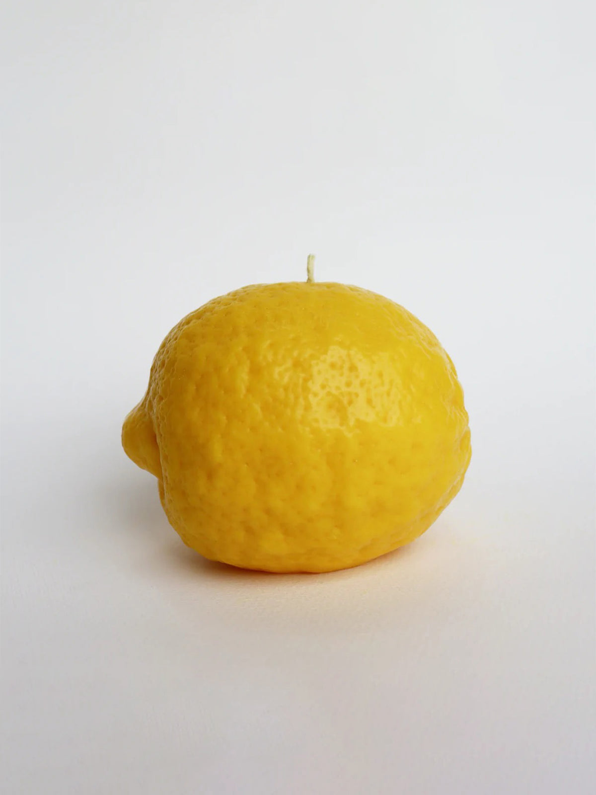 An Organic Lemon Candle – Large by Nonna&#39;s Grocer on a white background.