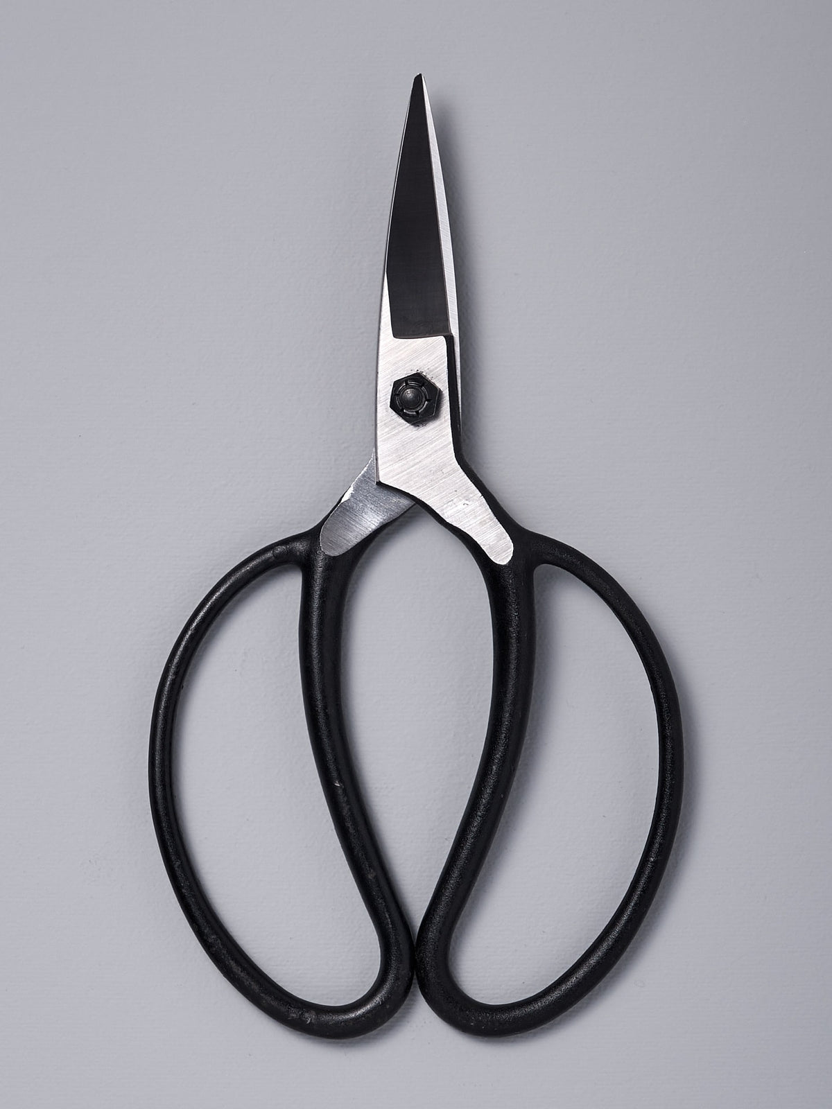 A pair of Okatsune Garden Scissors №203 – Large on a gray background.