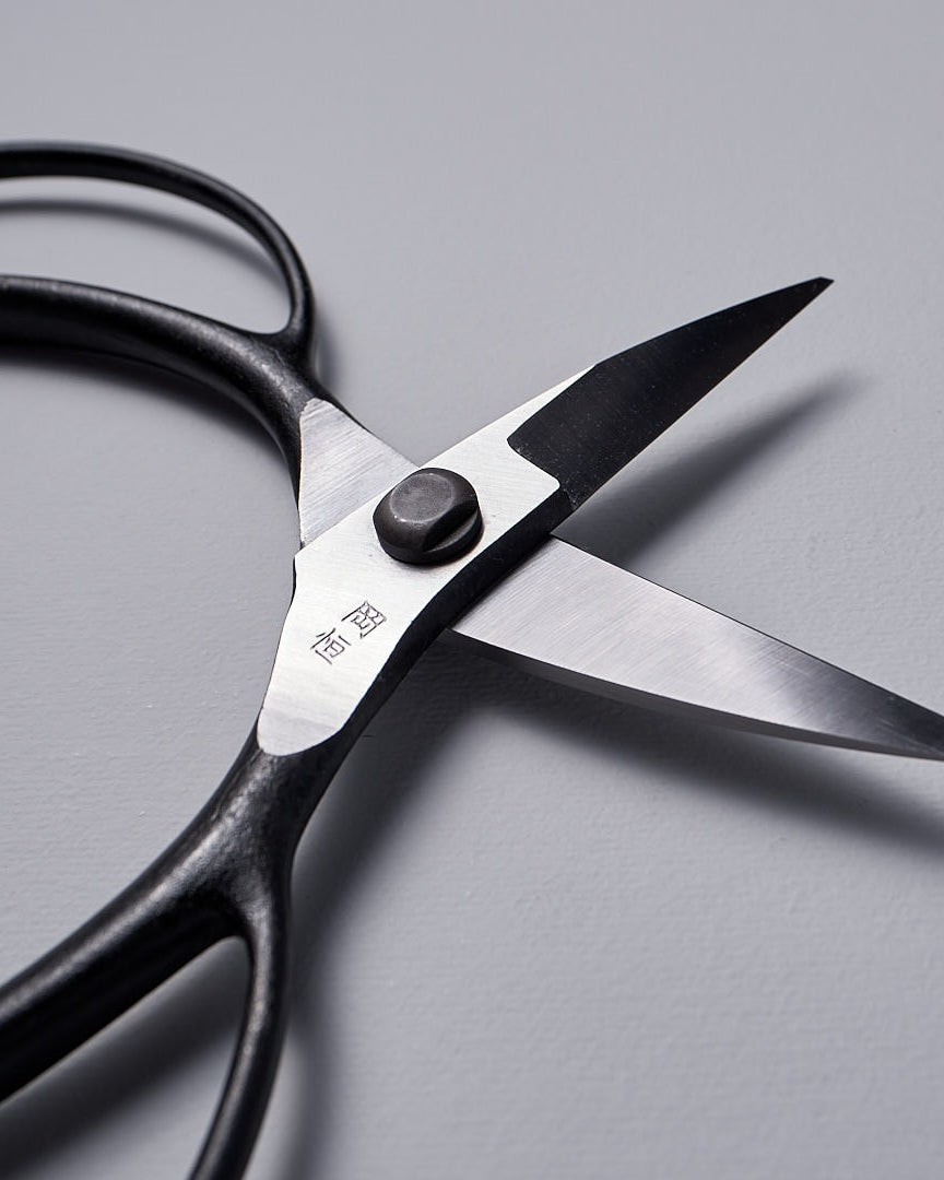 A pair of Okatsune Garden Scissors №221 – Small on a white surface.