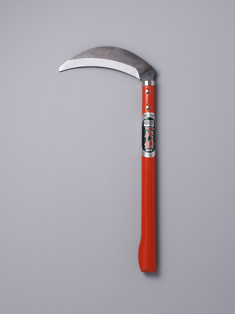 An Okatsune gardening sickle on a gray background.