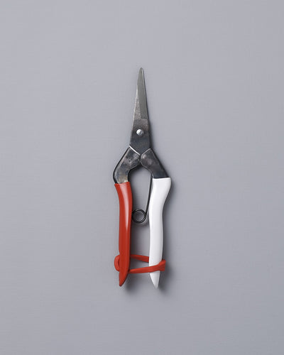 A pair of Okatsune Japanese Snips №304 on a gray background.