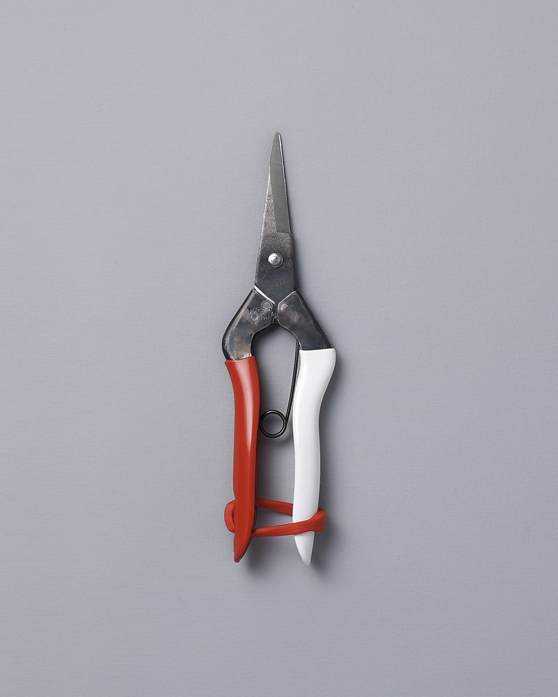 A pair of Okatsune Japanese Snips №304 on a gray background.