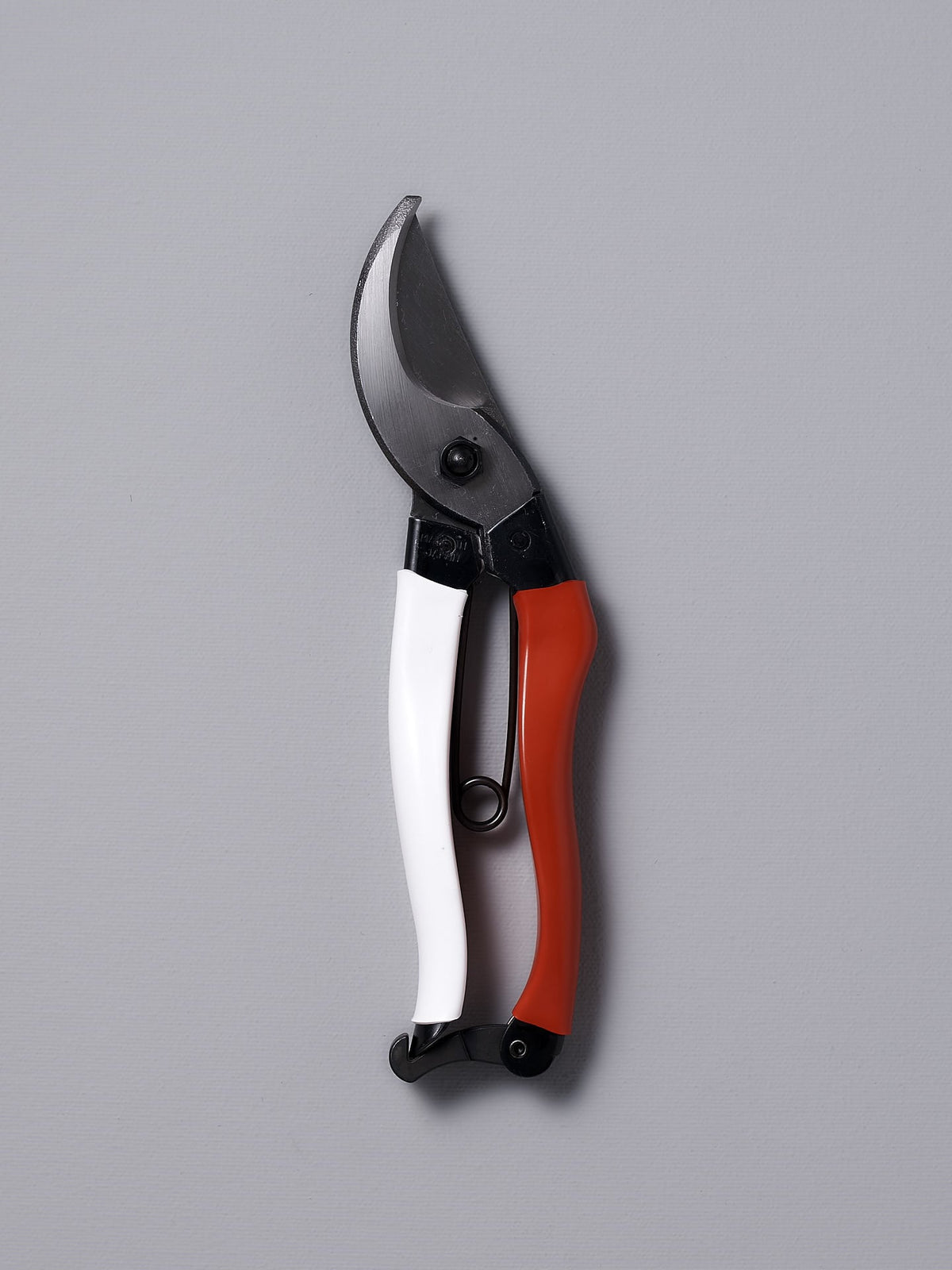 A pair of Okatsune Japanese Secateurs №103 with red and white handles.