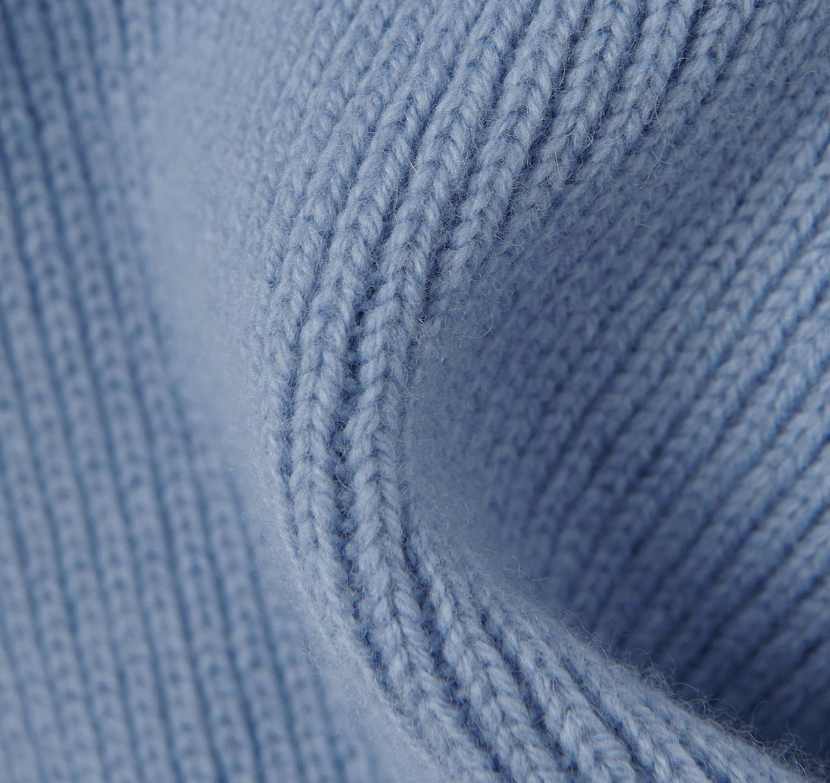 A close up of a Recycled Wool Scarf – Light Blue by Organic Basics.