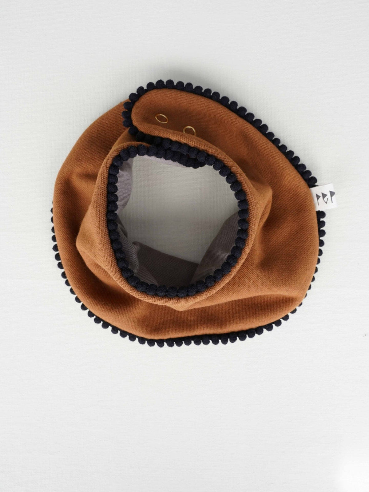 A Baby Gift Box – Copper cowboy hat with a black pom pom by Peppin.