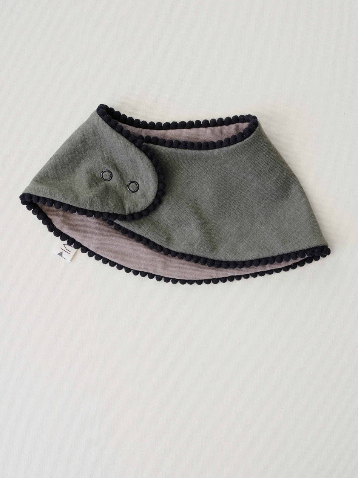 A Baby Gift Box - Forest bib with black trim from Peppin.