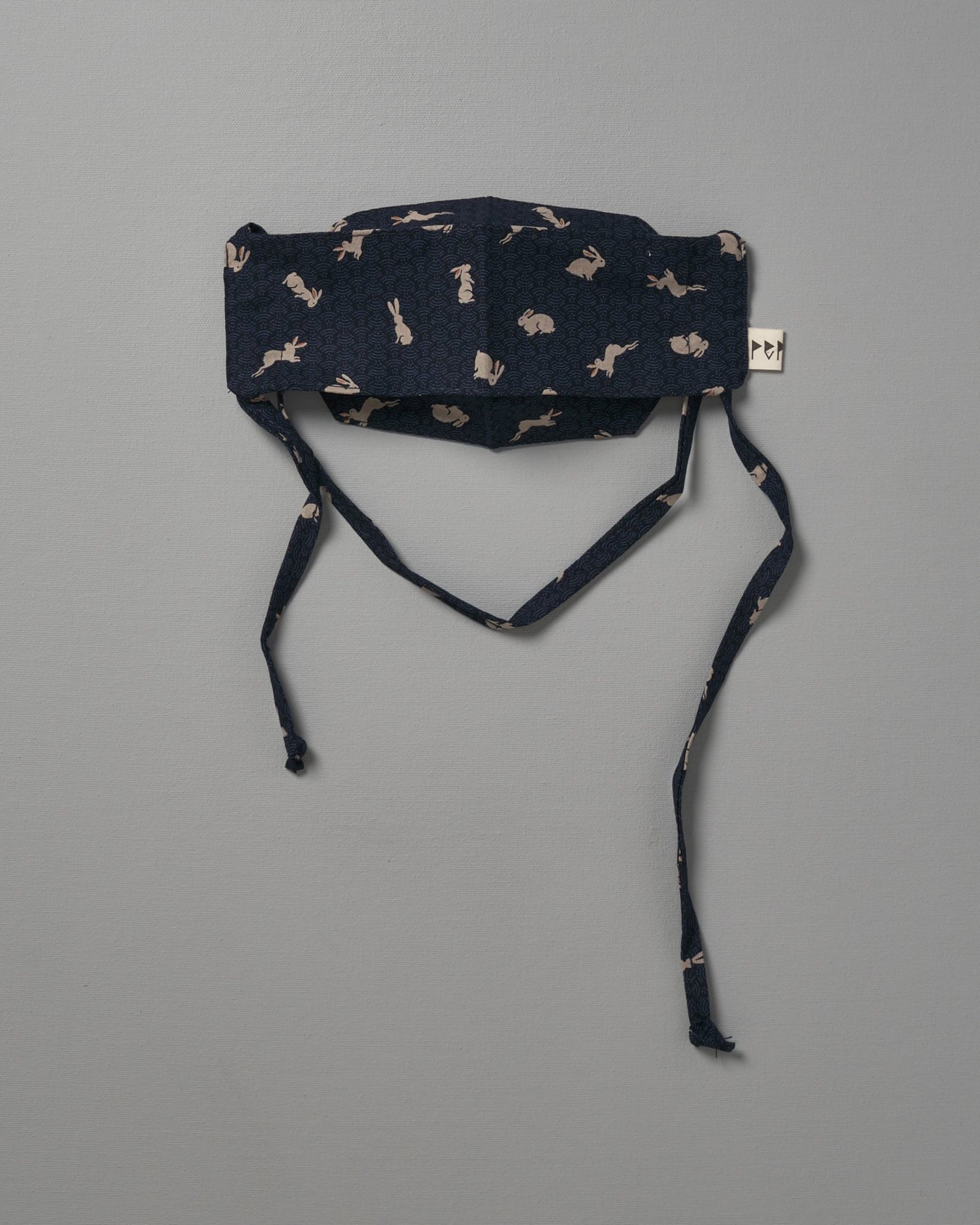 A Kids Face Mask - Japanese Print by Peppin with a black and white pattern.