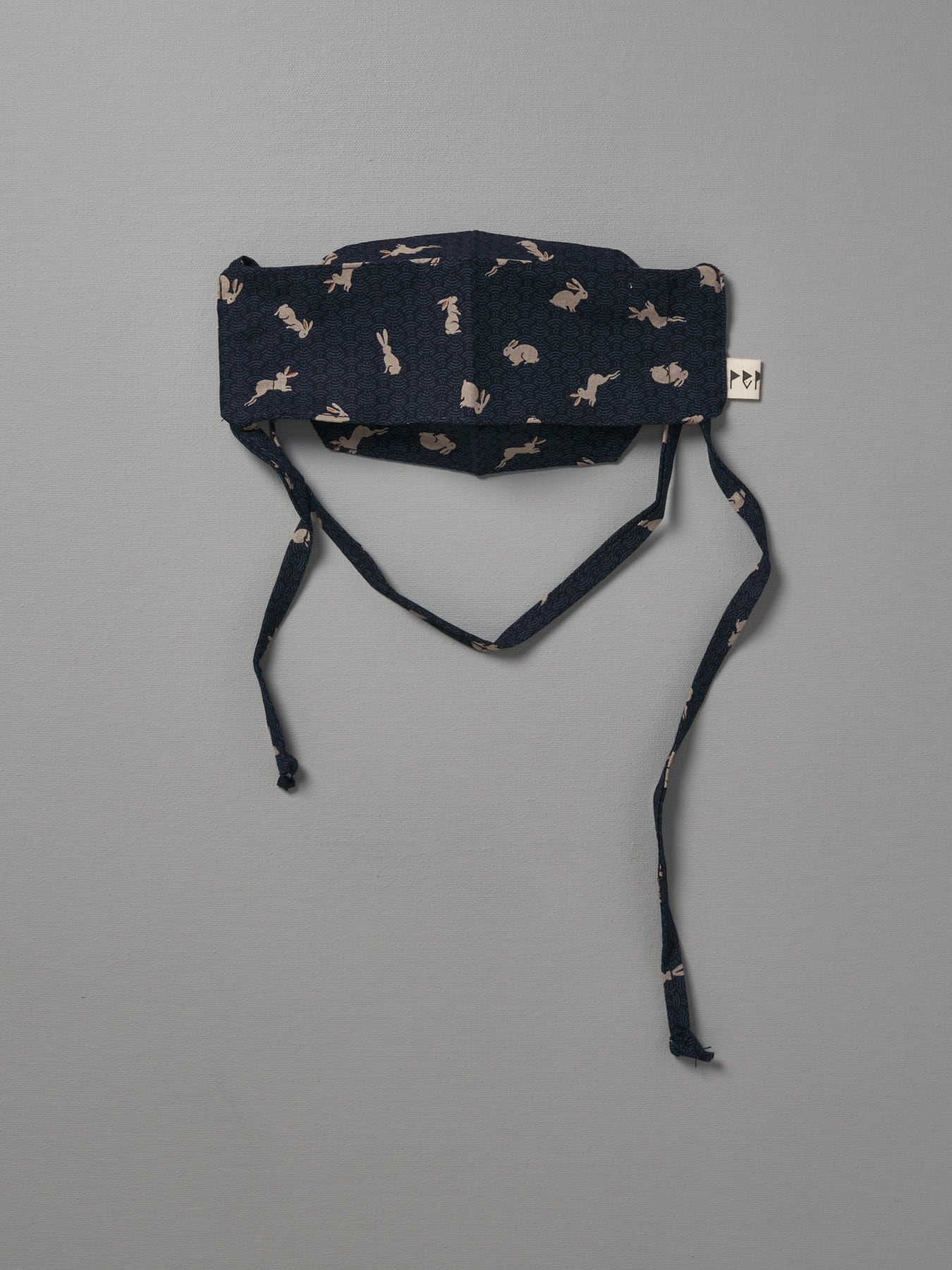 A Kids Face Mask - Japanese Print by Peppin with a black and white pattern.