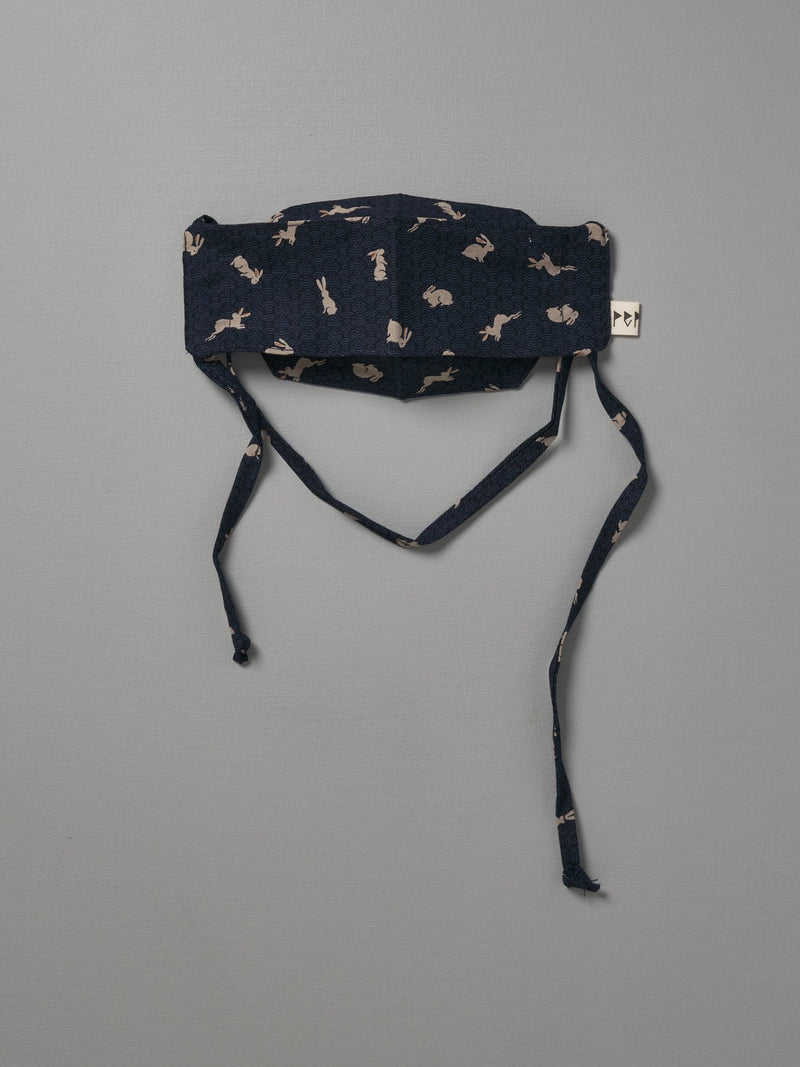 A Kids Face Mask - Japanese Print by Peppin with a black and white pattern.