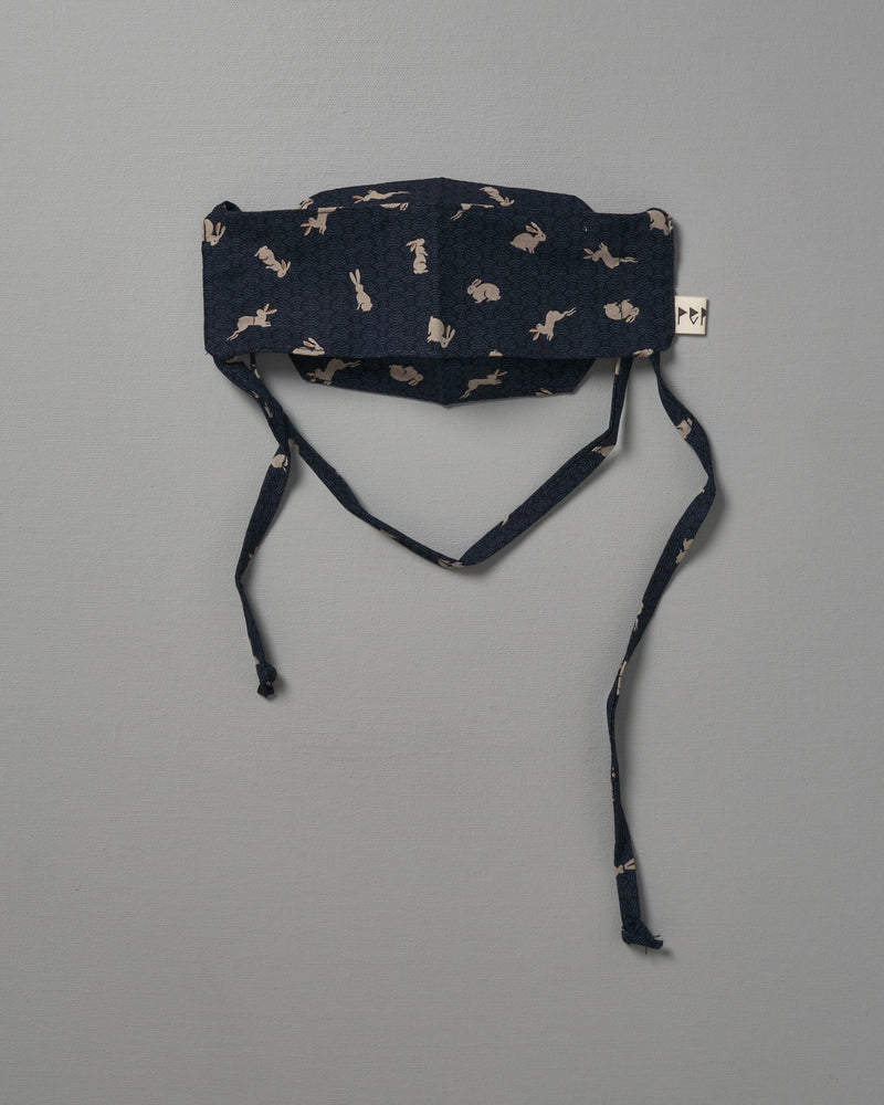 A Kids Face Mask - Japanese Print by Peppin with a black and white pattern.