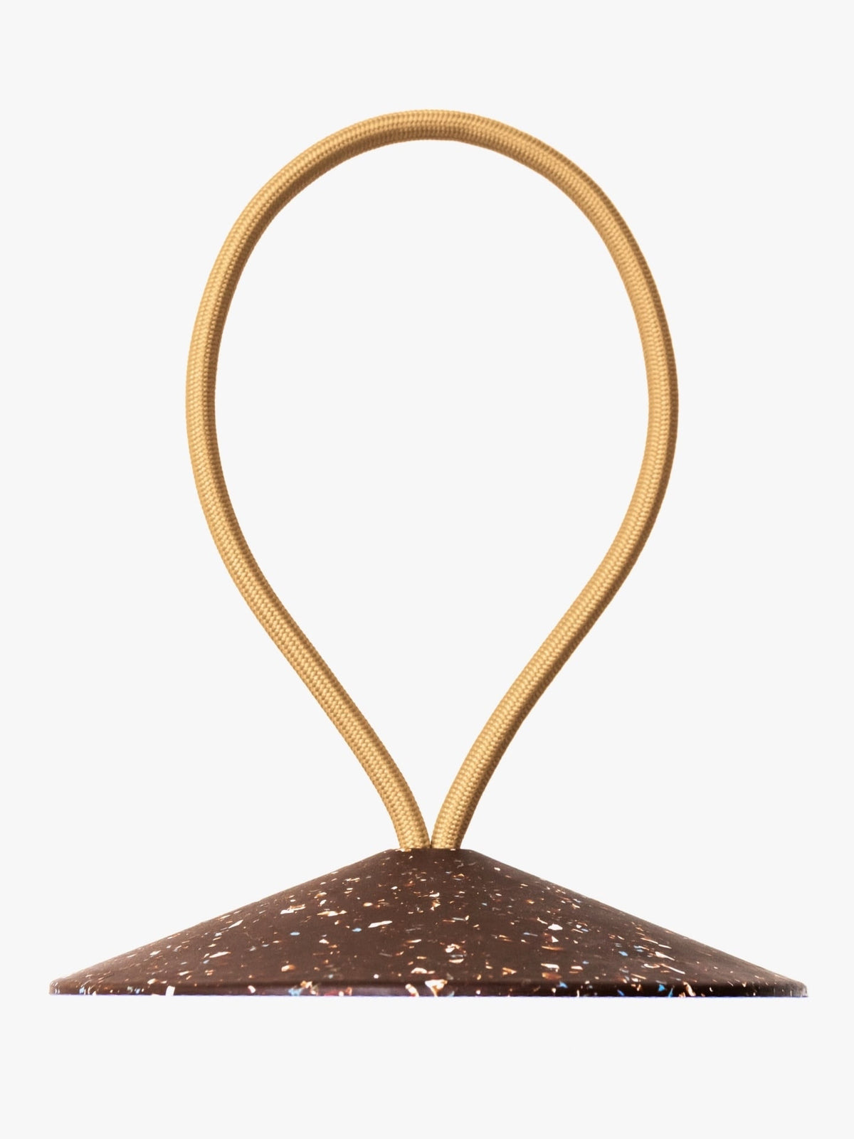 A brown and gold STOP – Doorstop on a white background.