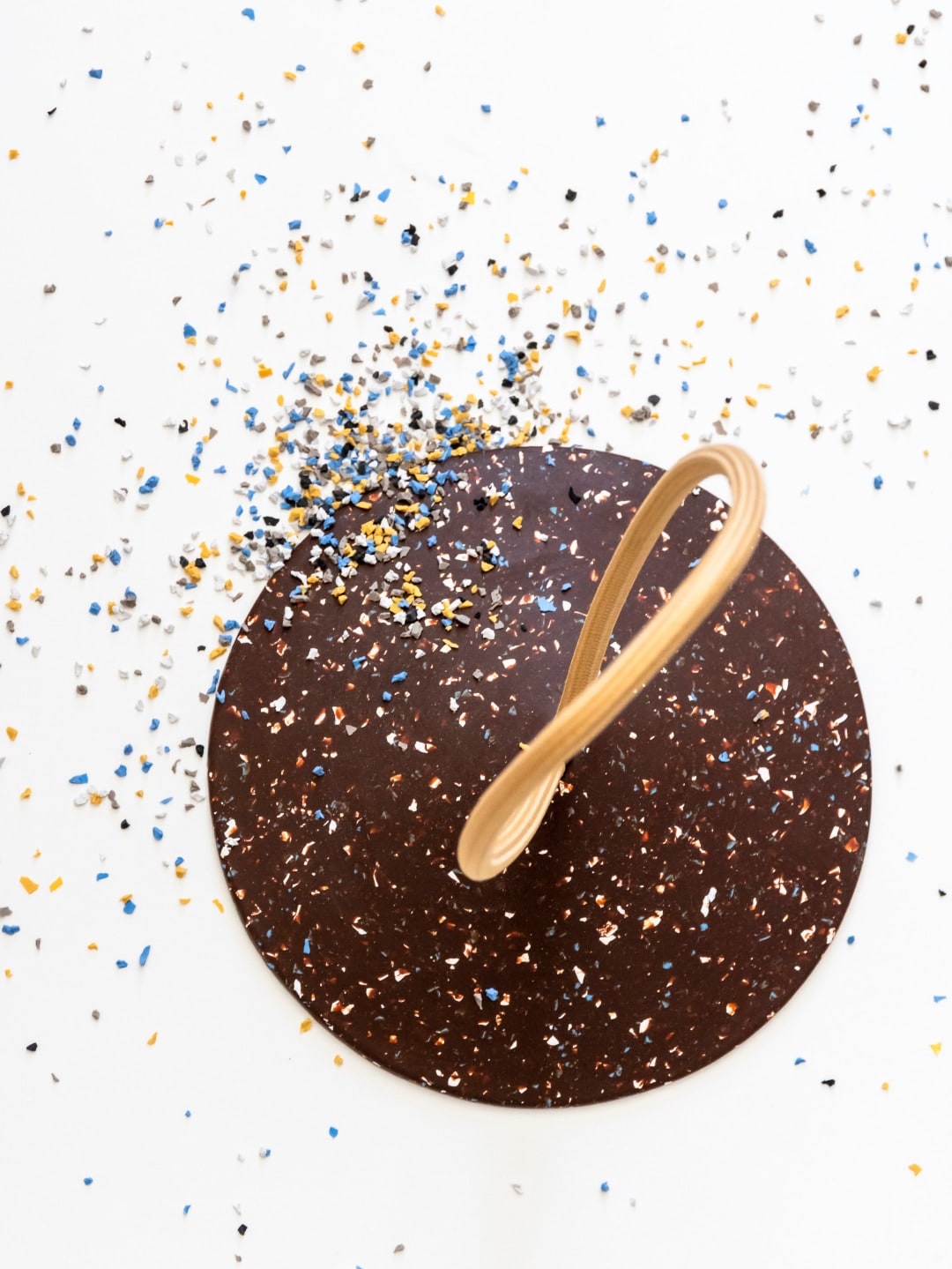 A STOP – Doorstop with confetti and a wooden spoon.
