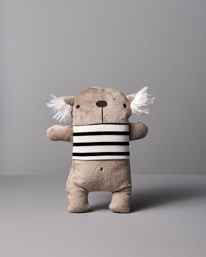A Raplapla stuffed koala named Gilles le Koala with a black and white stripe.