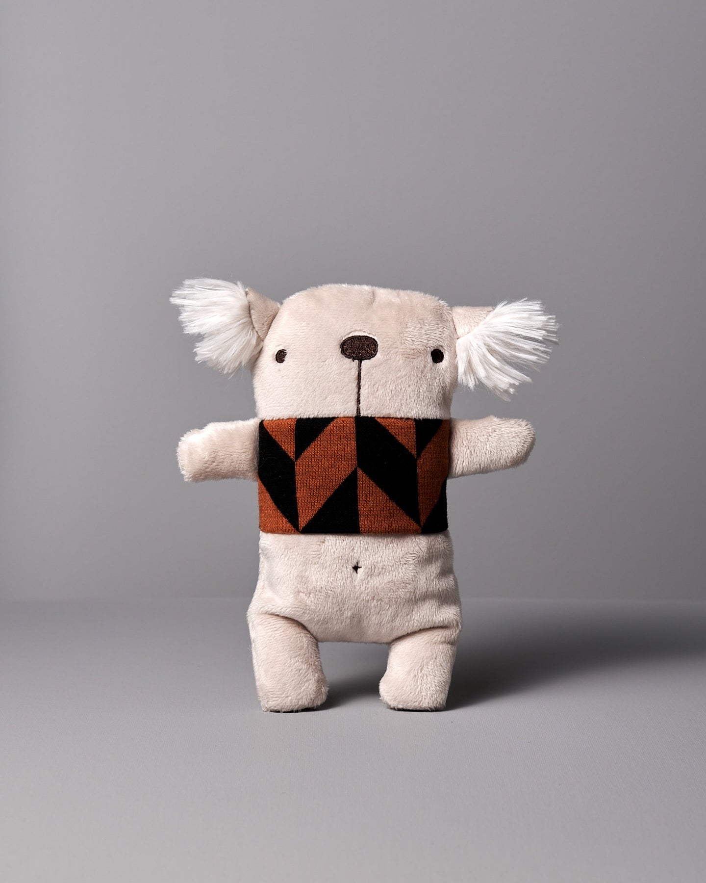 A Gilles le Koala No.2 stuffed animal with a brown and black scarf by Raplapla.