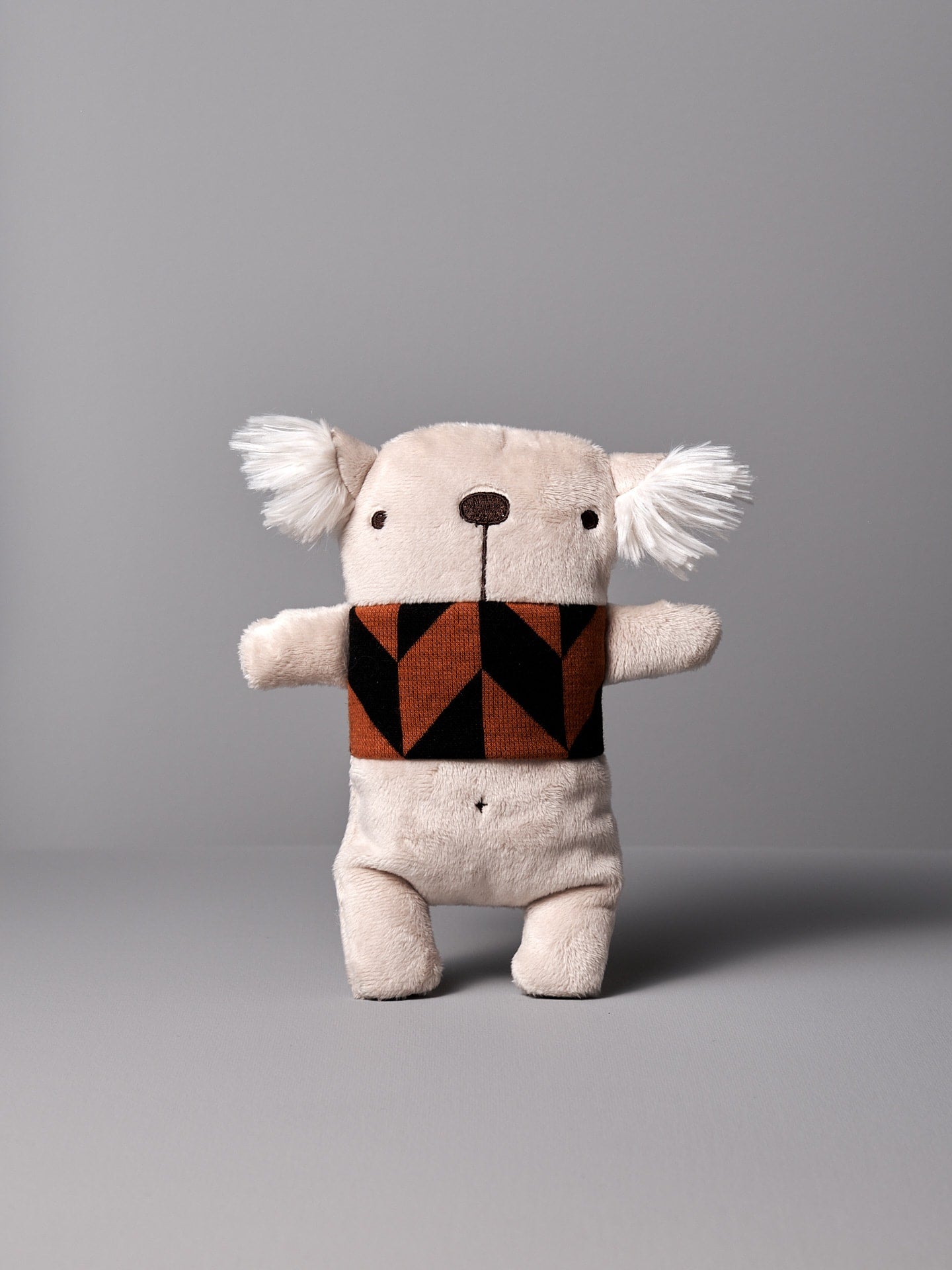 A Gilles le Koala No.2 stuffed animal with a brown and black scarf by Raplapla.