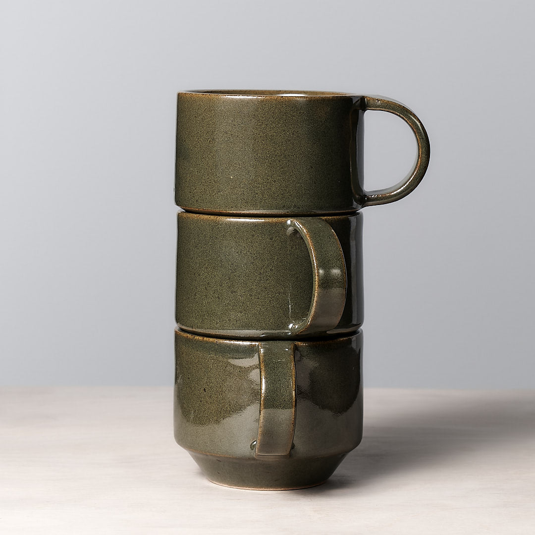 Three Richard Beauchamp Medium Stacking Mugs – Green glaze ceramic.