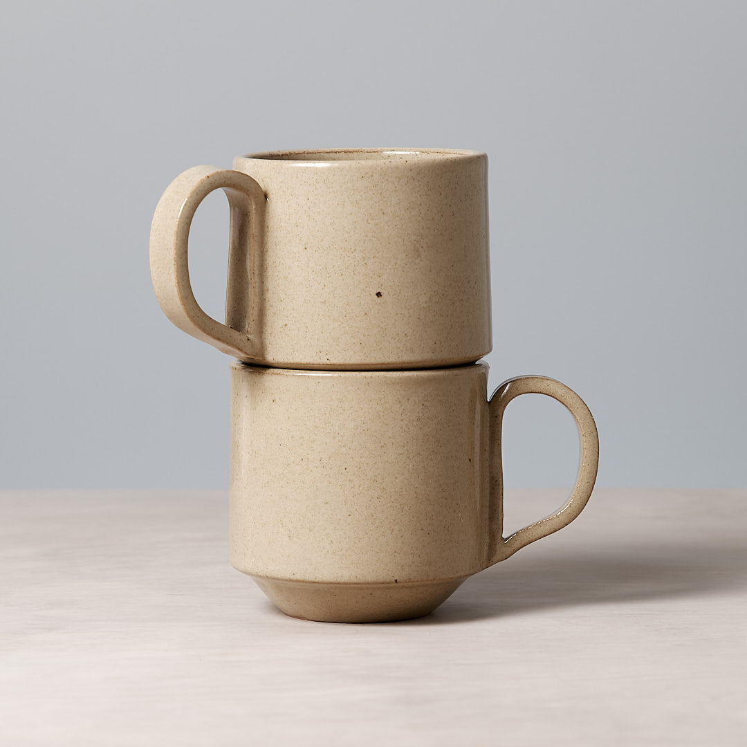 Two Large Stacking Mugs – Sand from Richard Beauchamp stacked on top of each other.