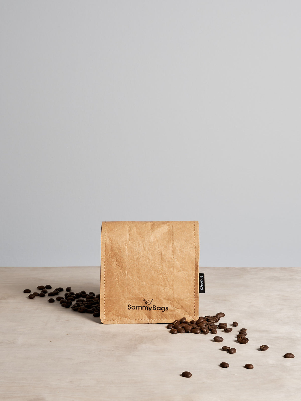 A Sammy Bags Reusable Snack Bag of coffee beans on a table.