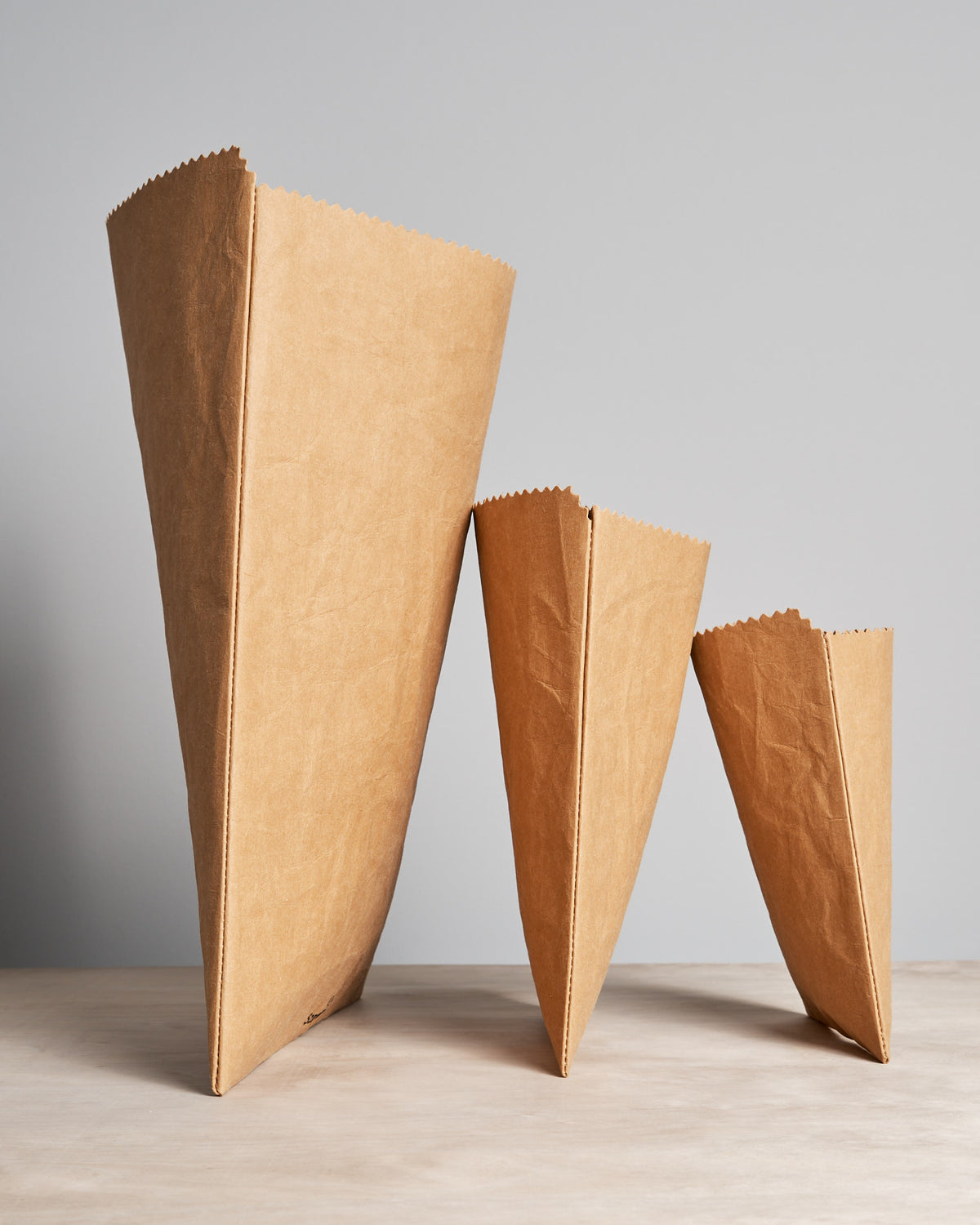 Three Sammy Bags reusable flat bags – medium on a wooden table.