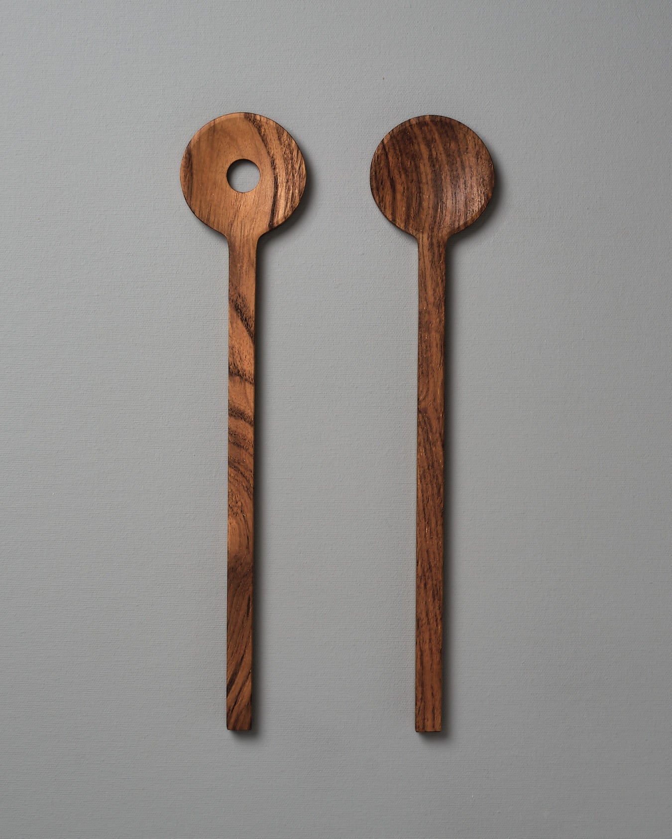 Two Fulla Salad Servers by Skagerak on a grey background.