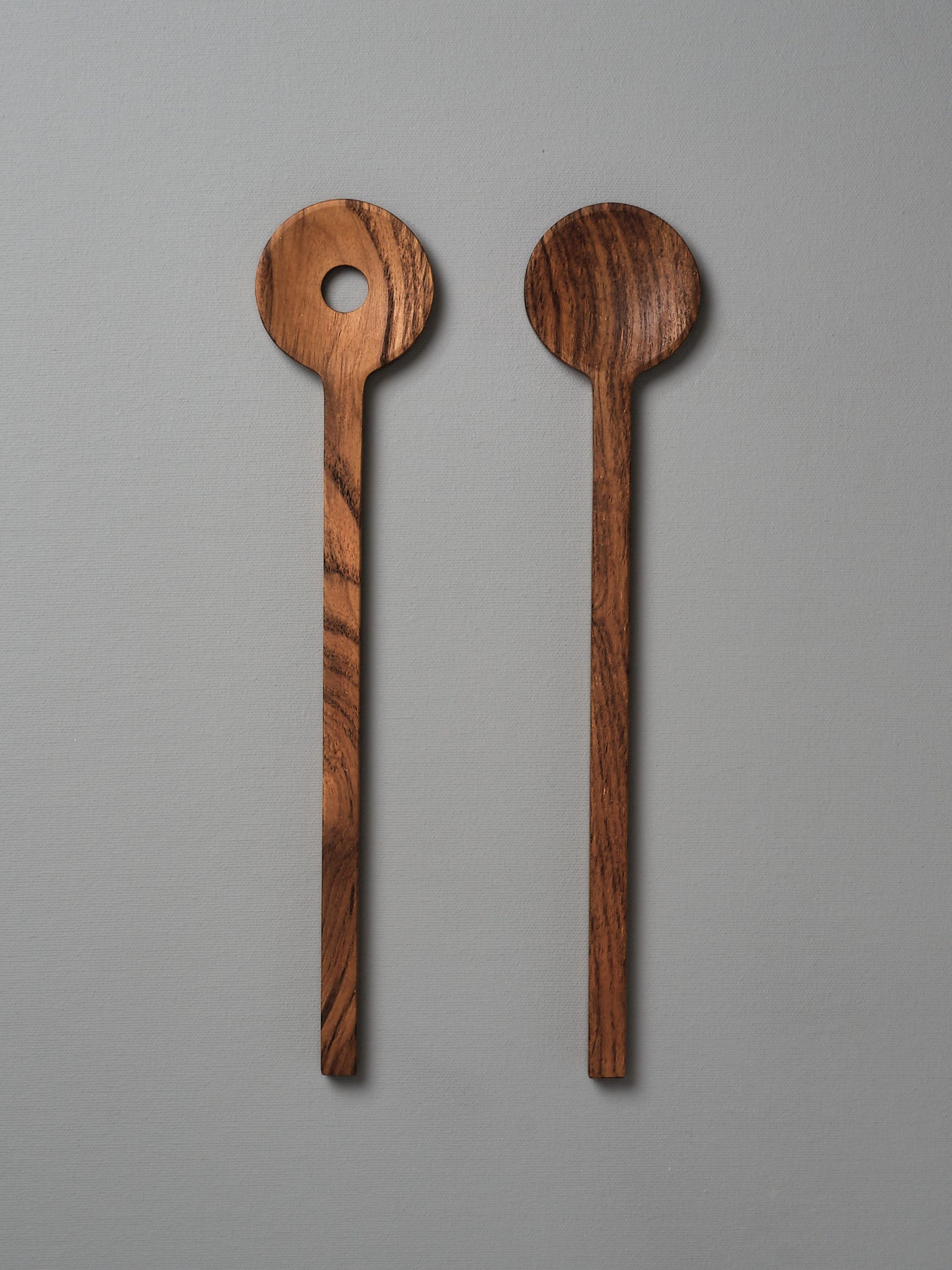 Two Fulla Salad Servers by Skagerak on a grey background.