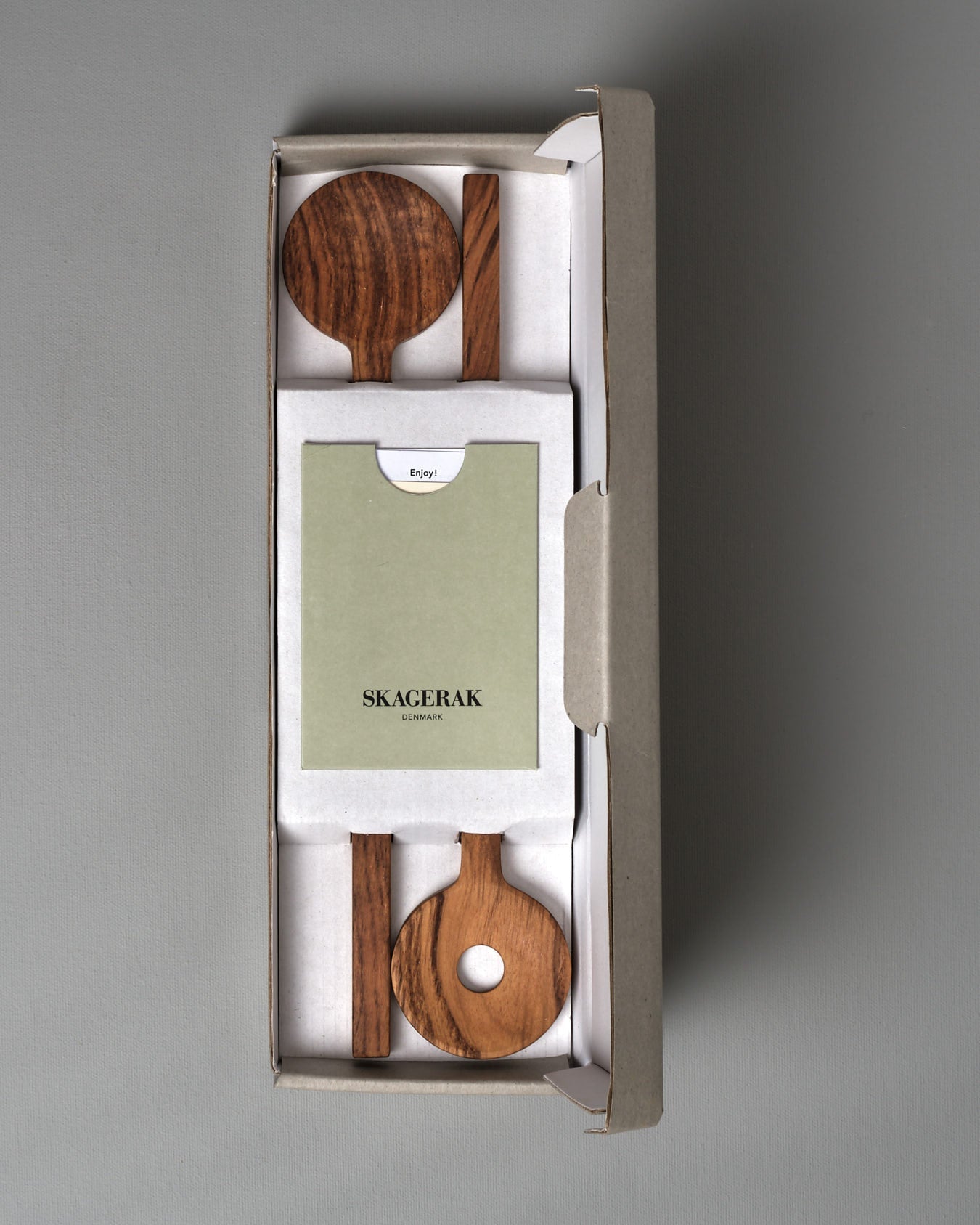 Two Fulla Salad Servers by Skagerak on a grey background.