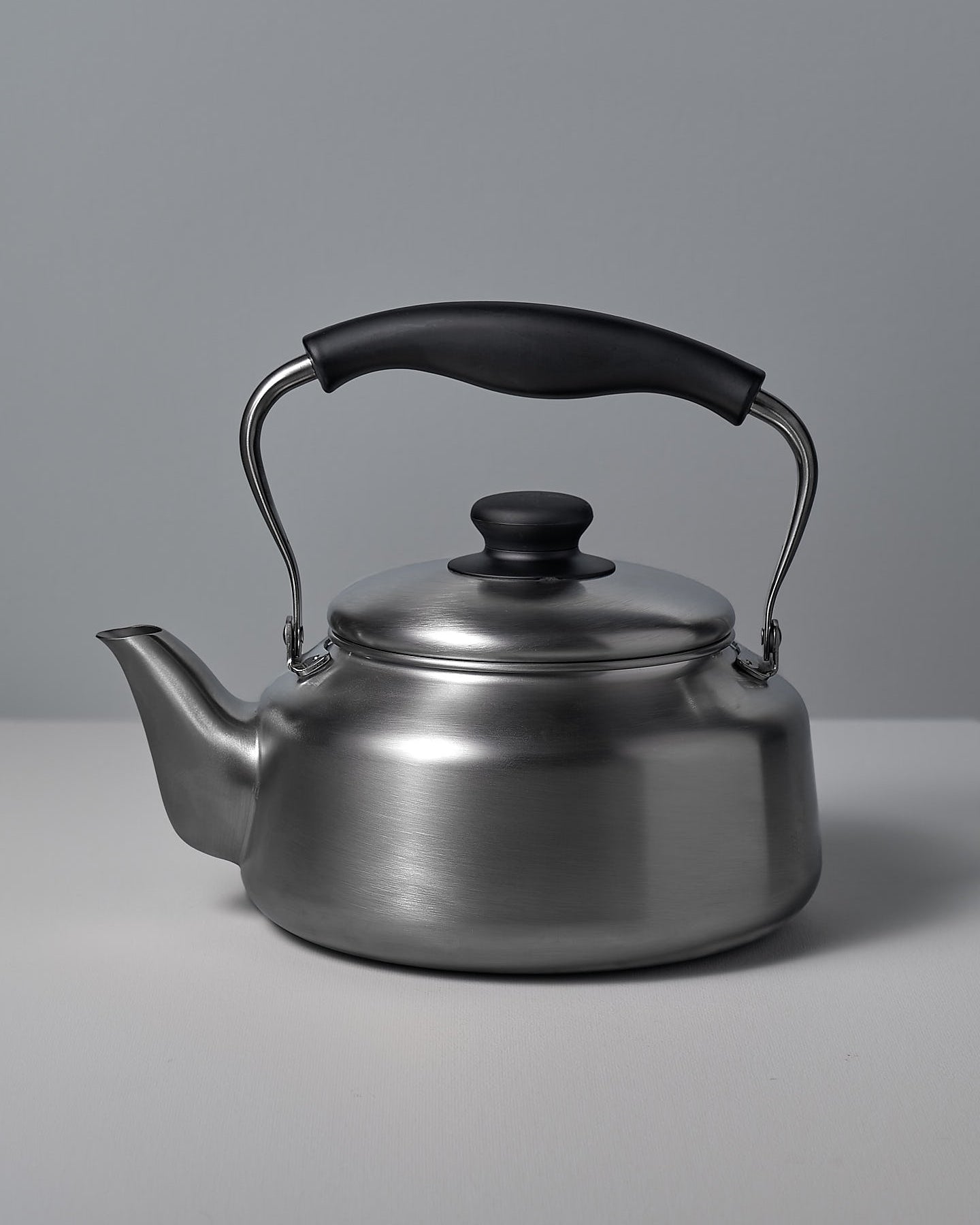 A Sori Yanagi Stove-top Kettle - Brushed Steel on a white background.