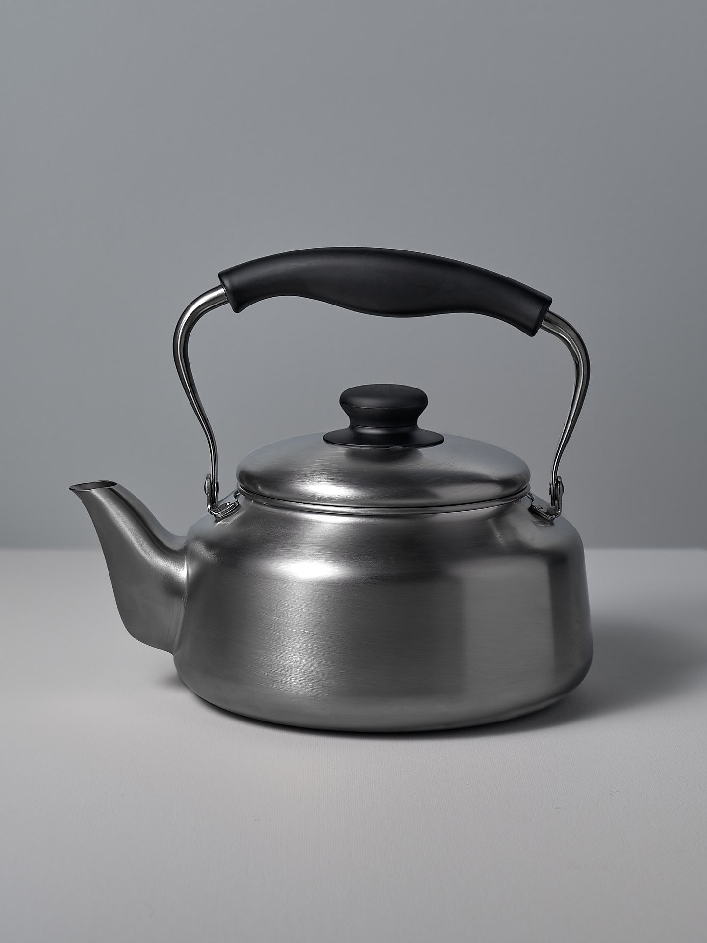 A Sori Yanagi Stove-top Kettle - Brushed Steel on a white background.