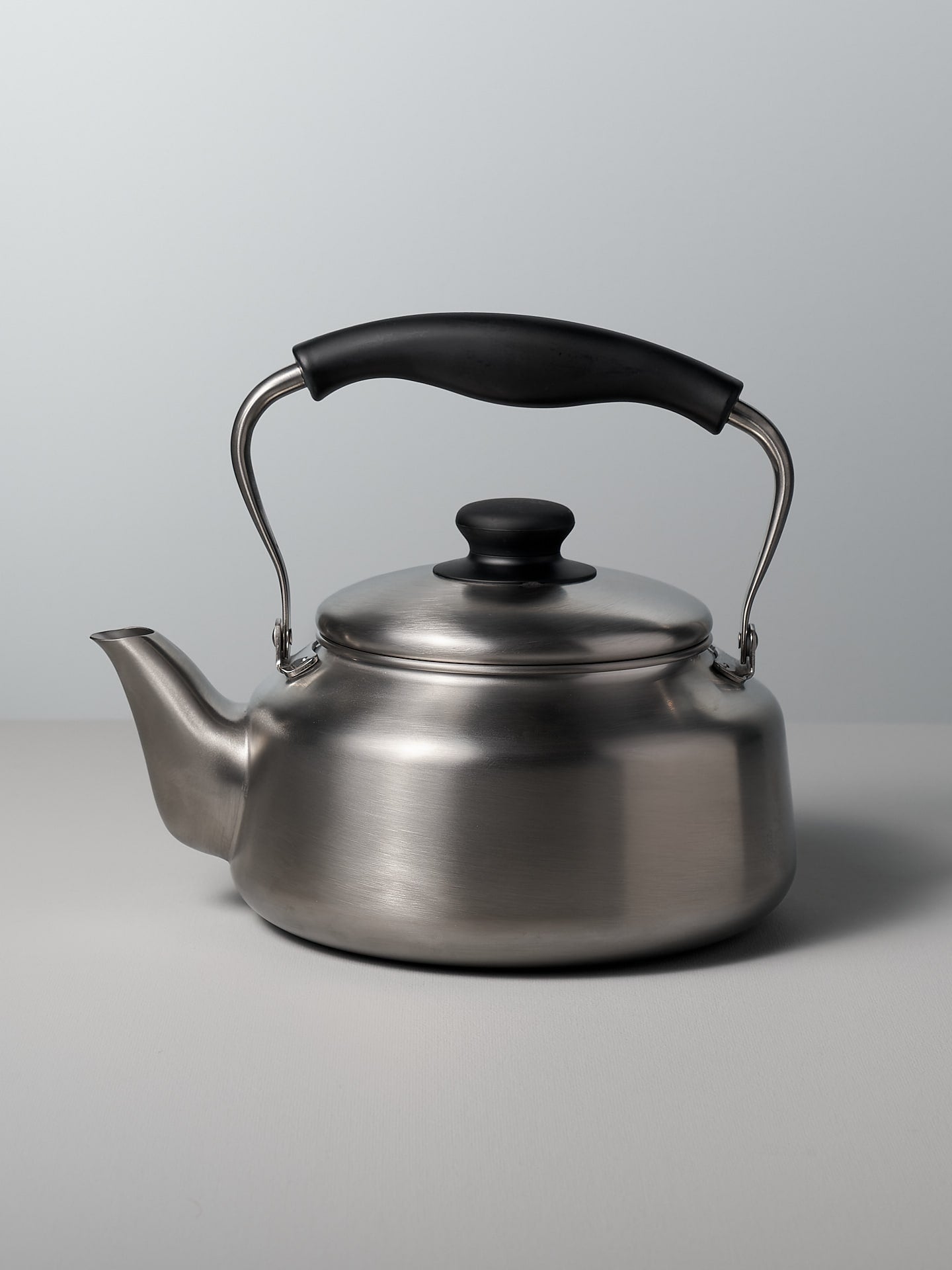 A Sori Yanagi Stove-top Kettle - Brushed Steel on a white background.