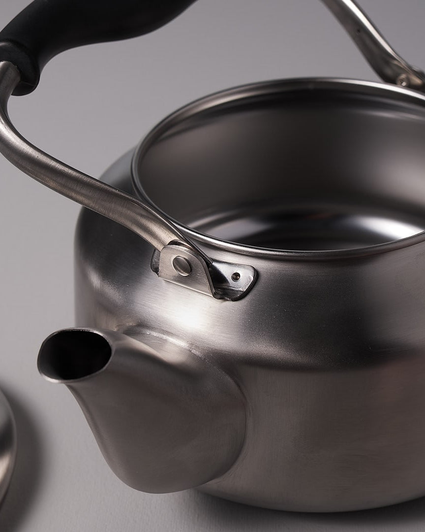 A Sori Yanagi Stove-top Kettle - Brushed Steel on a white background.
