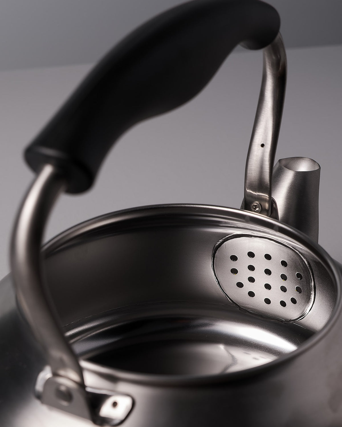 A Sori Yanagi Stove-top Kettle - Brushed Steel on a white background.