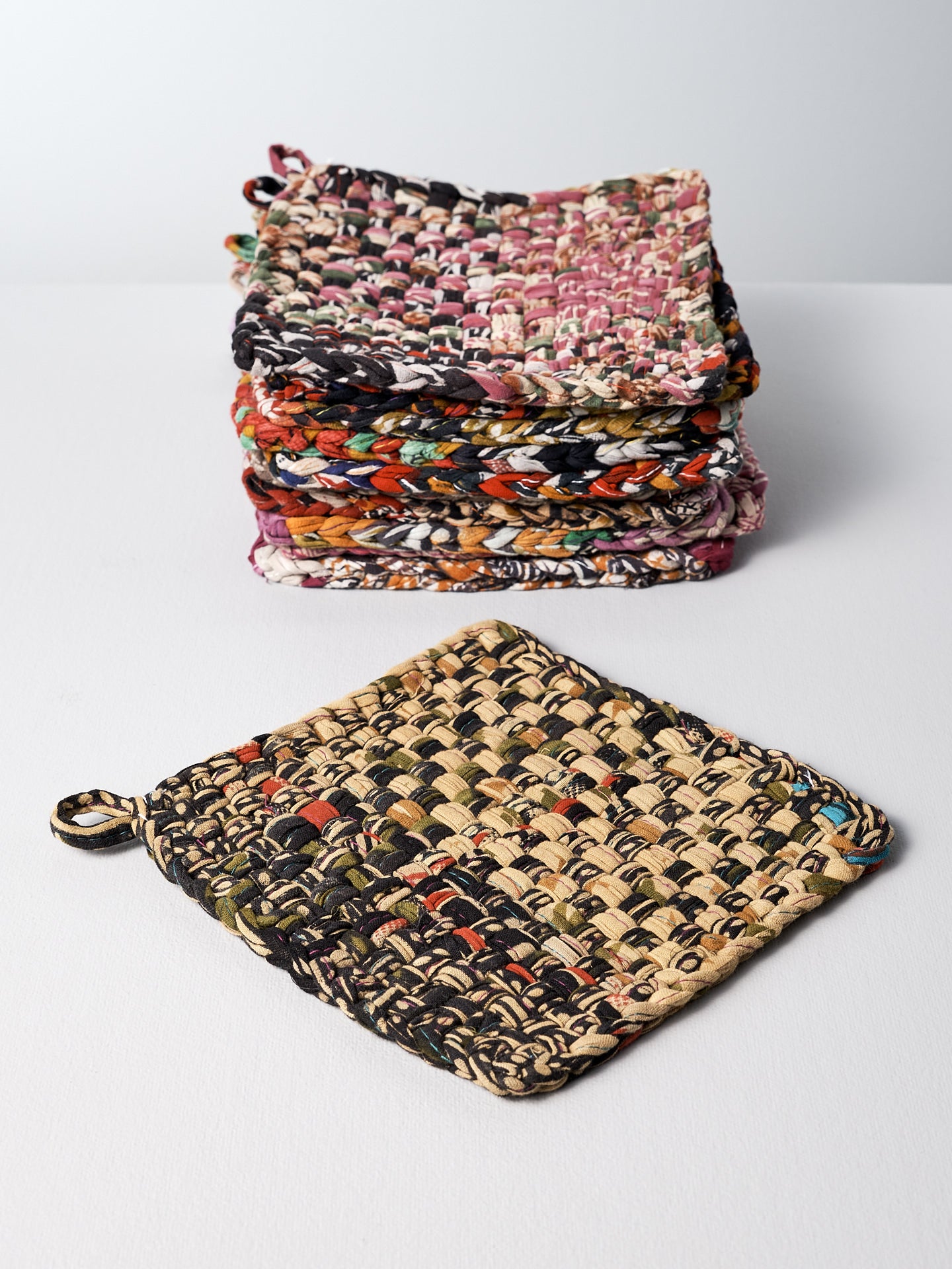 A set of Stitchwallah Sari Pot & Oven-tray Holders on a white surface.