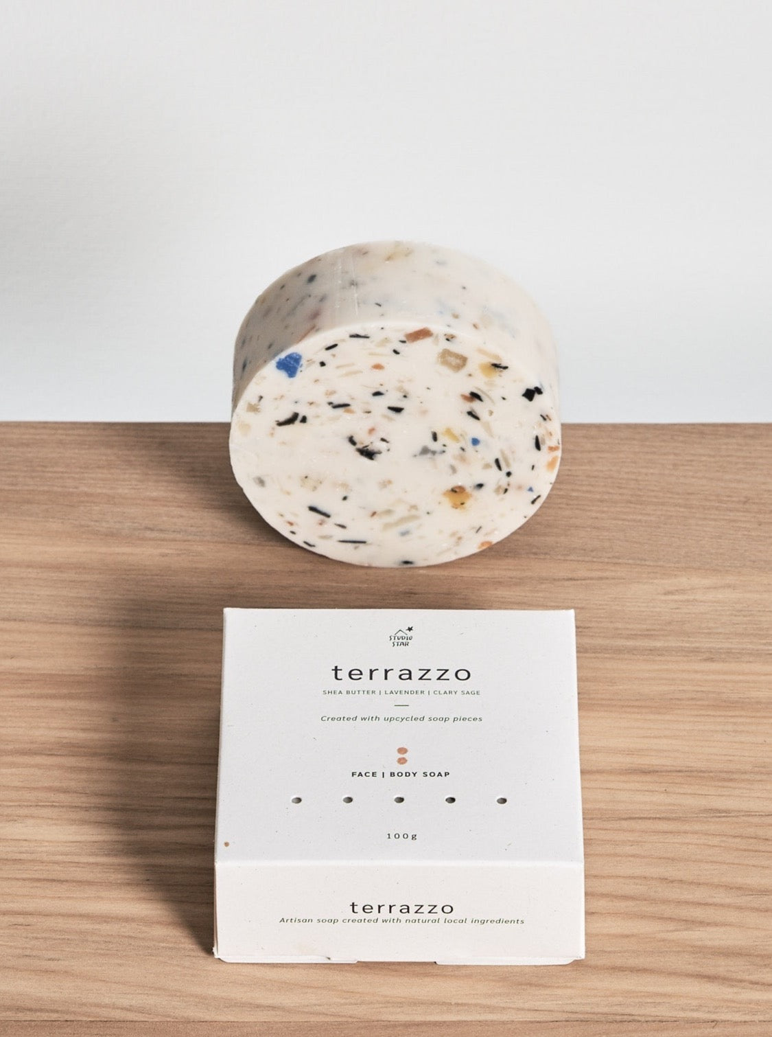 A Terrazzo Soap by Studio Star with a box next to it.