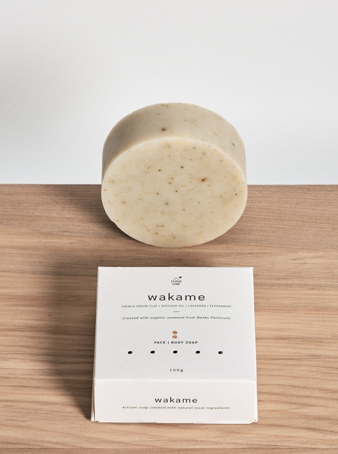 A Wakame Soap bar sitting on a wooden table. (Brand: Studio Star)