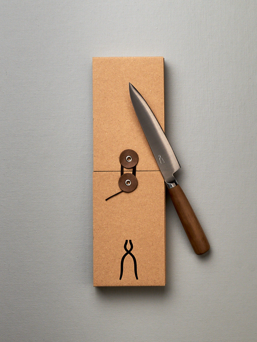 A brown box with a Tadafusa Hocho Petty Knife in it.