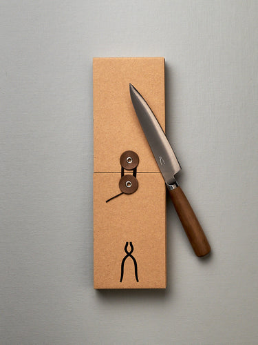 A brown box with a Tadafusa Hocho Petty Knife in it.
