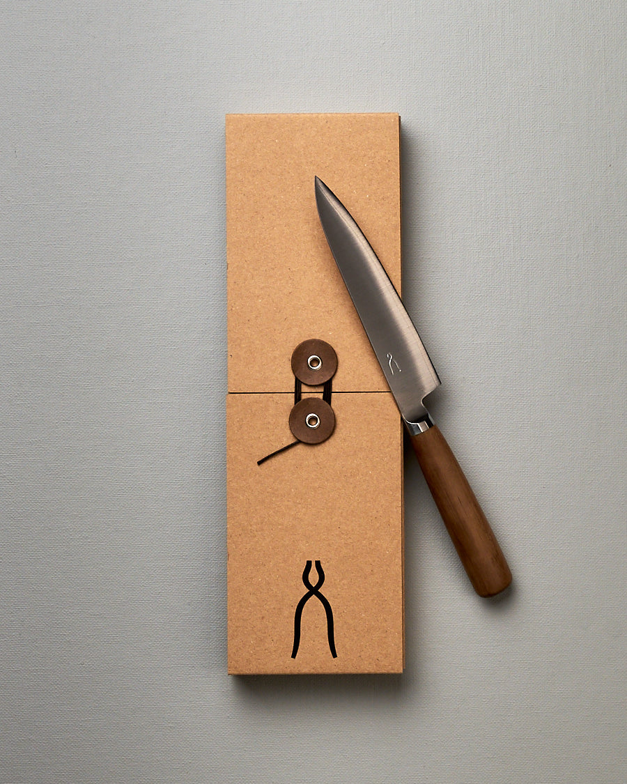 A brown box with a Tadafusa Hocho Petty Knife in it.