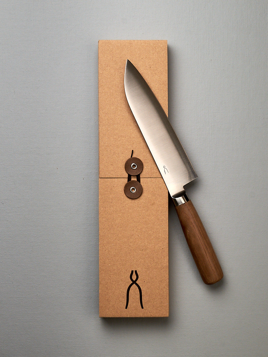A brown box with a Tadafusa Hocho Santoku Knife in it.