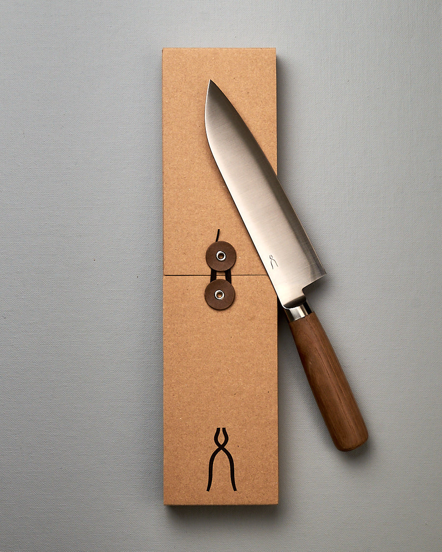 A brown box with a Tadafusa Hocho Santoku Knife in it.
