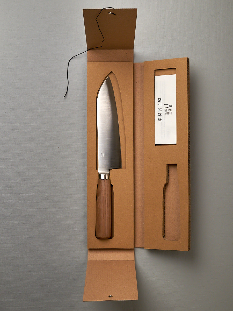 A Hocho Santoku knife in a cardboard box made by Tadafusa.